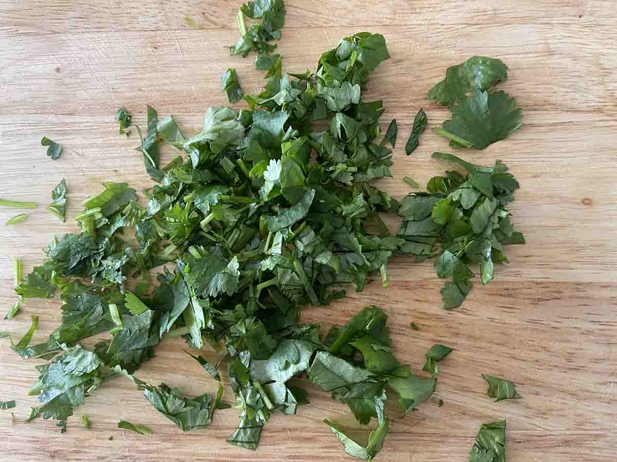 chopped coriander on a board.