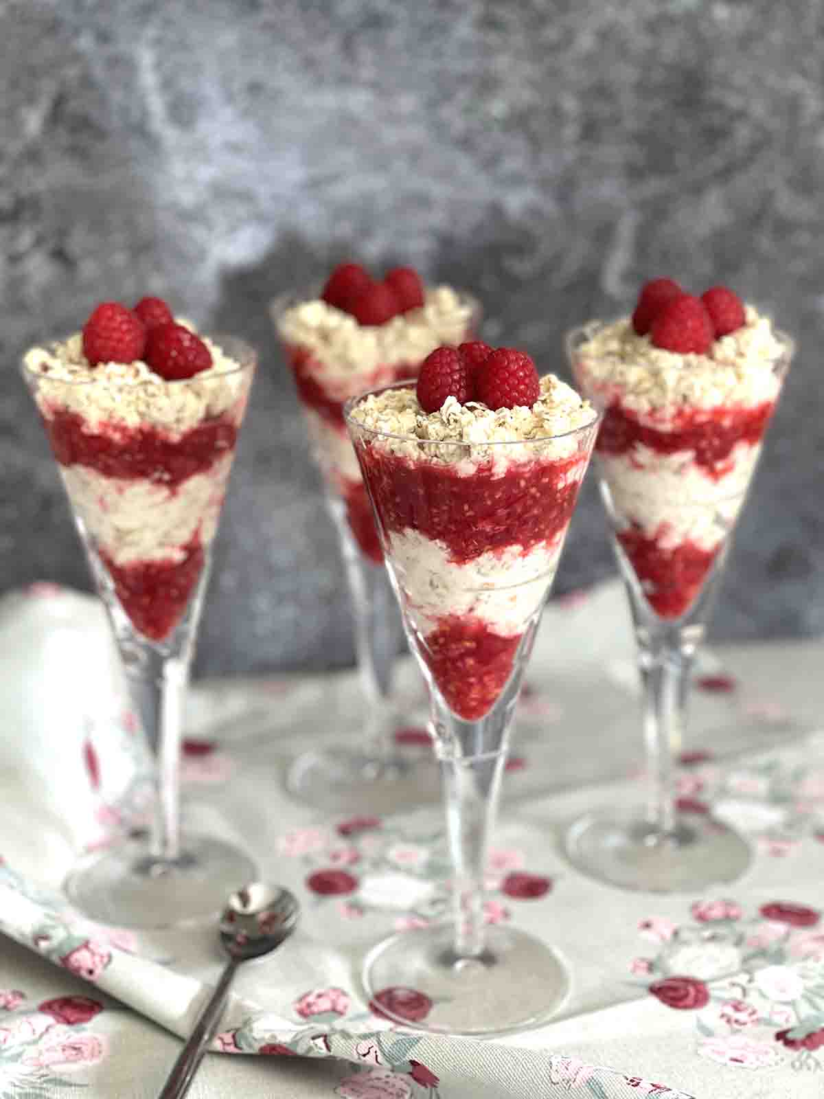 layered raspberry desserts in glasses.