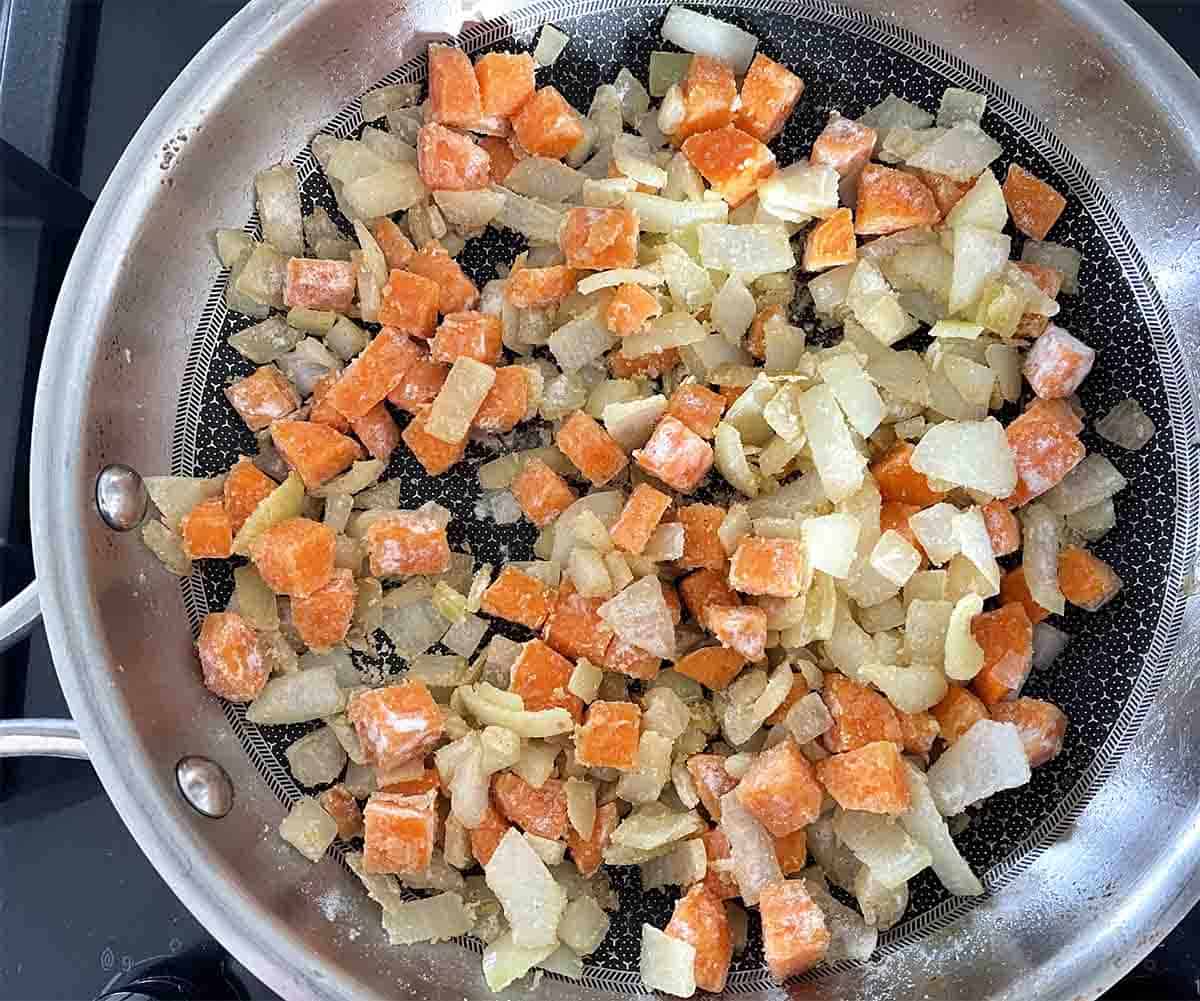 flour stirred into carrots and onions.
