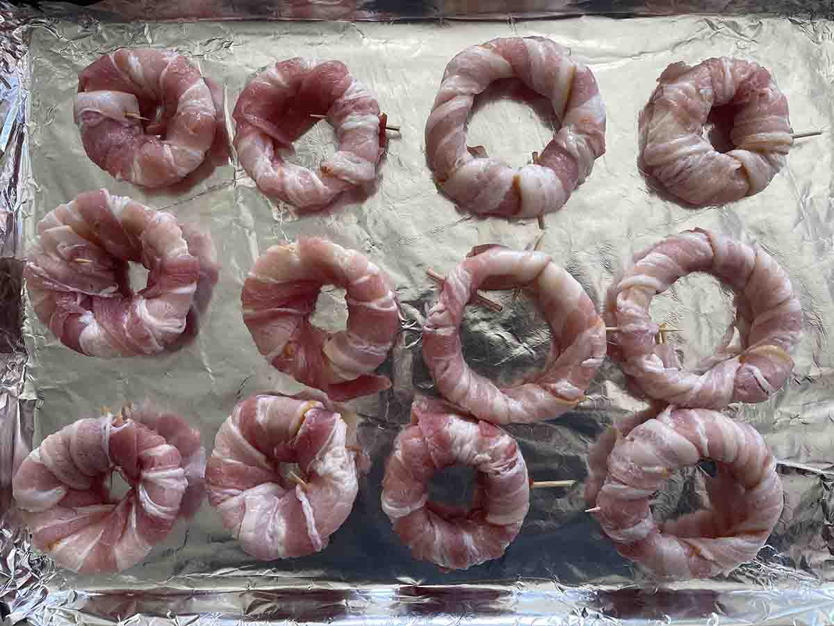 bacon wrapped rins on a tray.