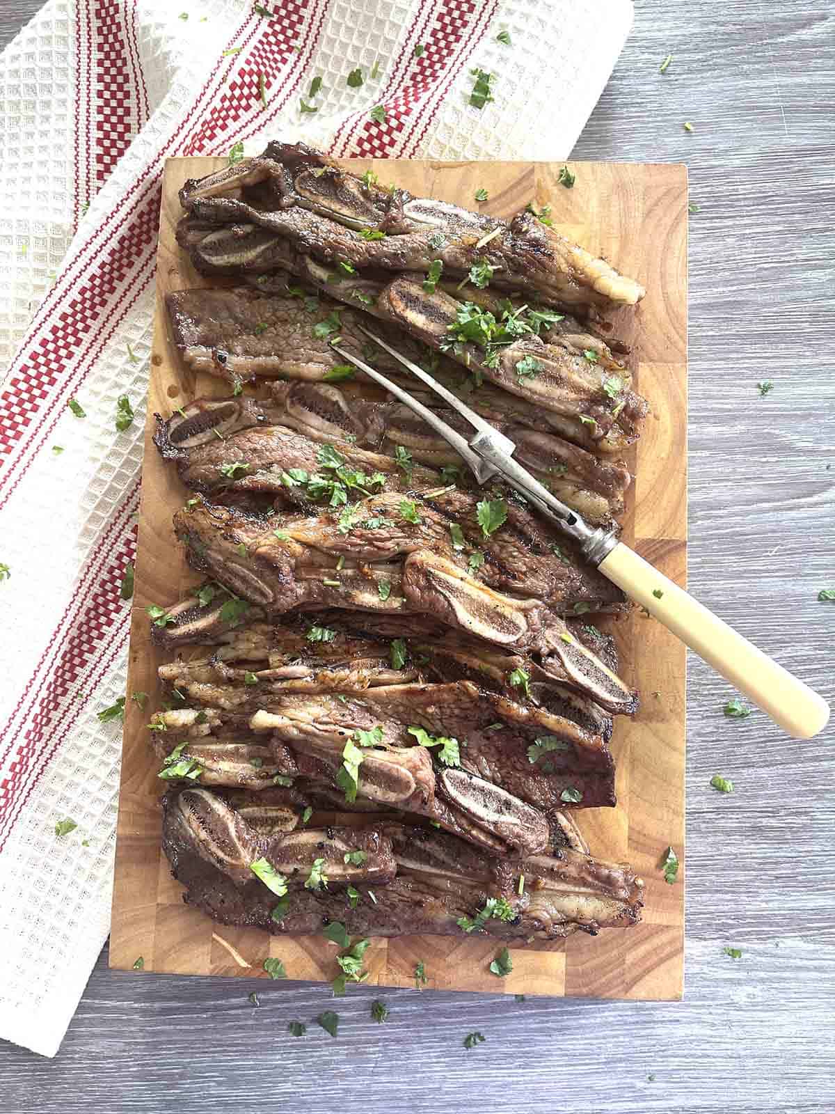 cooked flanken  short ribs on a board.