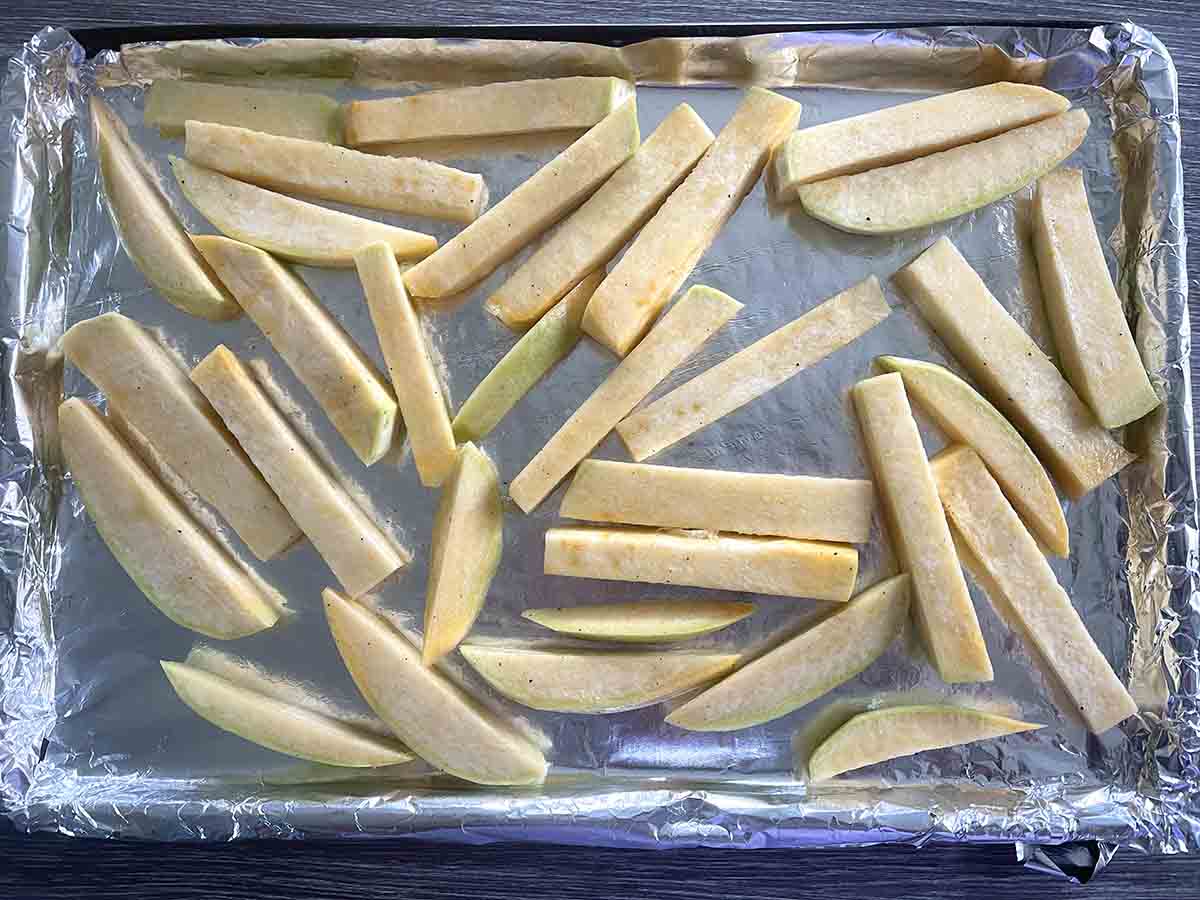 swede pieces on a baking tray.