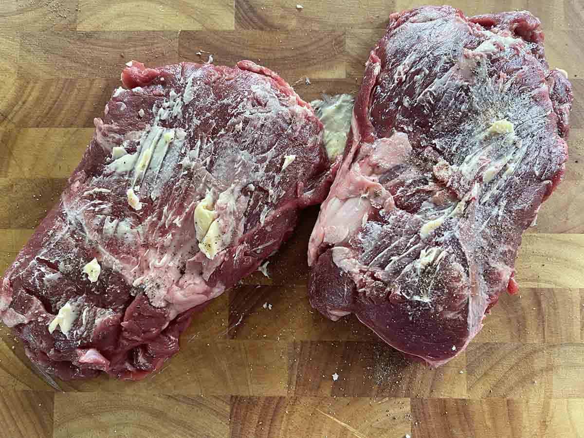 buttered pyster steak on a board.