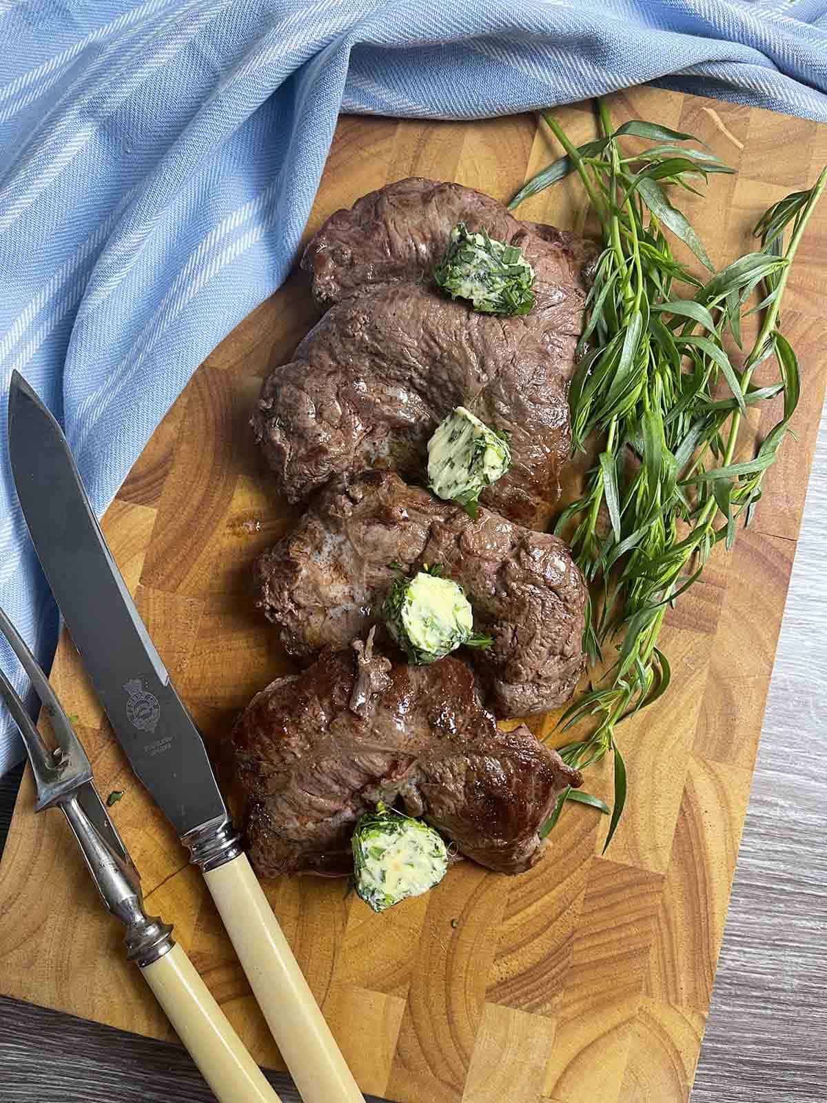 spider steak on a board.