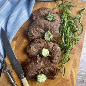 spider steak on a board.