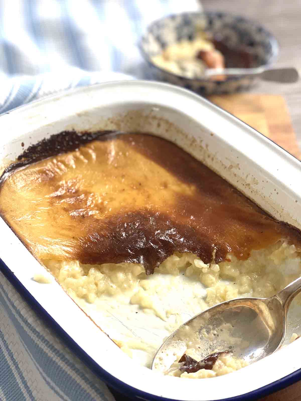rice pudding with portion scooped out with spoon.