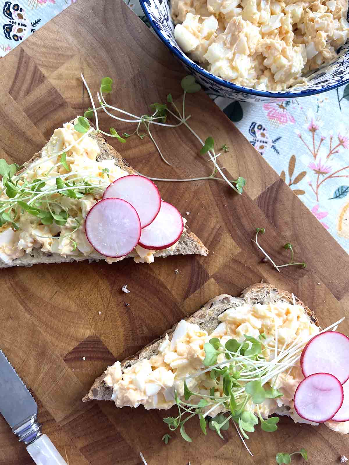 egg mayo sandwich on a board.