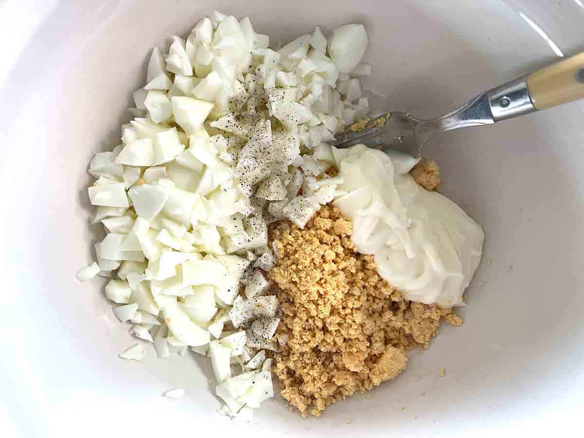 whites, yolks and mayonnaise in a bowl.