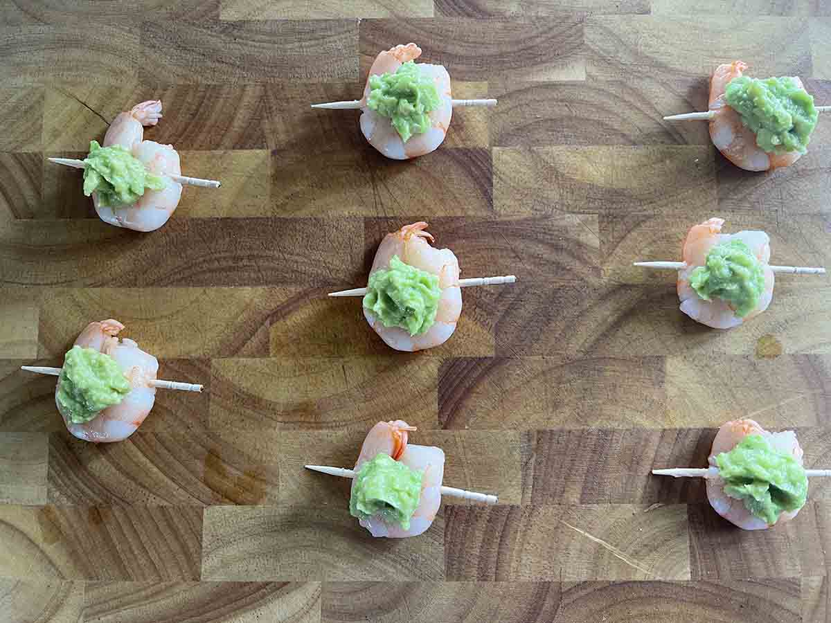 prawns topped with avocado.