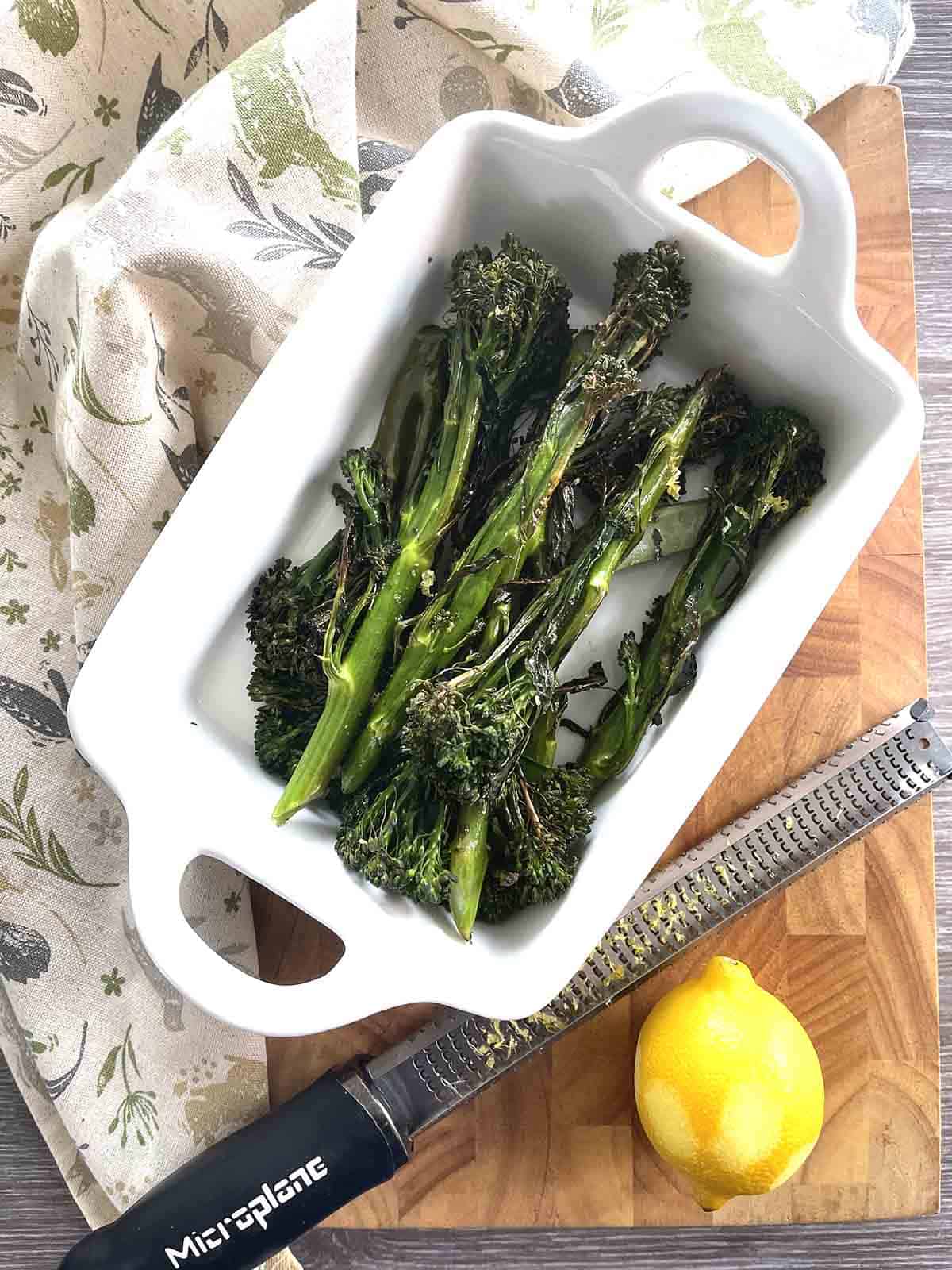 roasted longstem broccoli in a white dish.