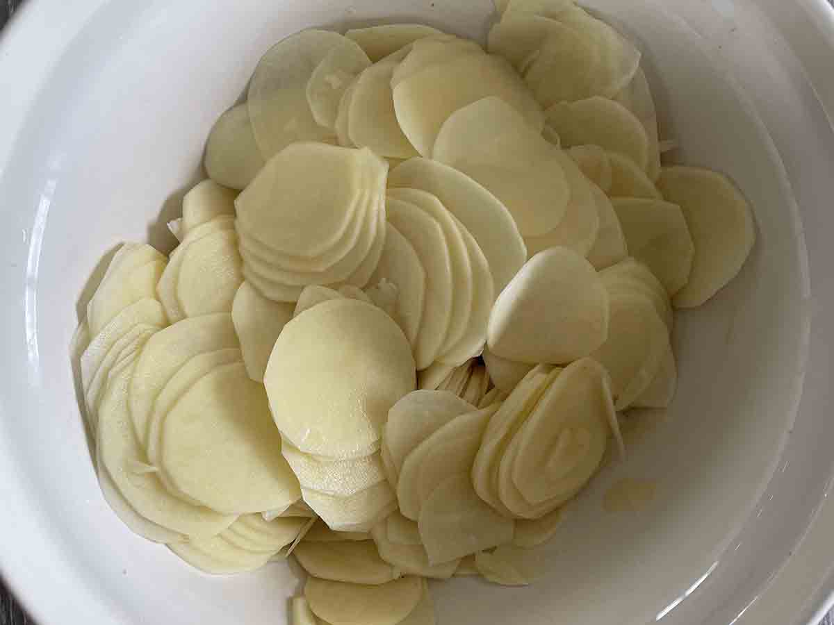 sliced potatoes in a bowl.