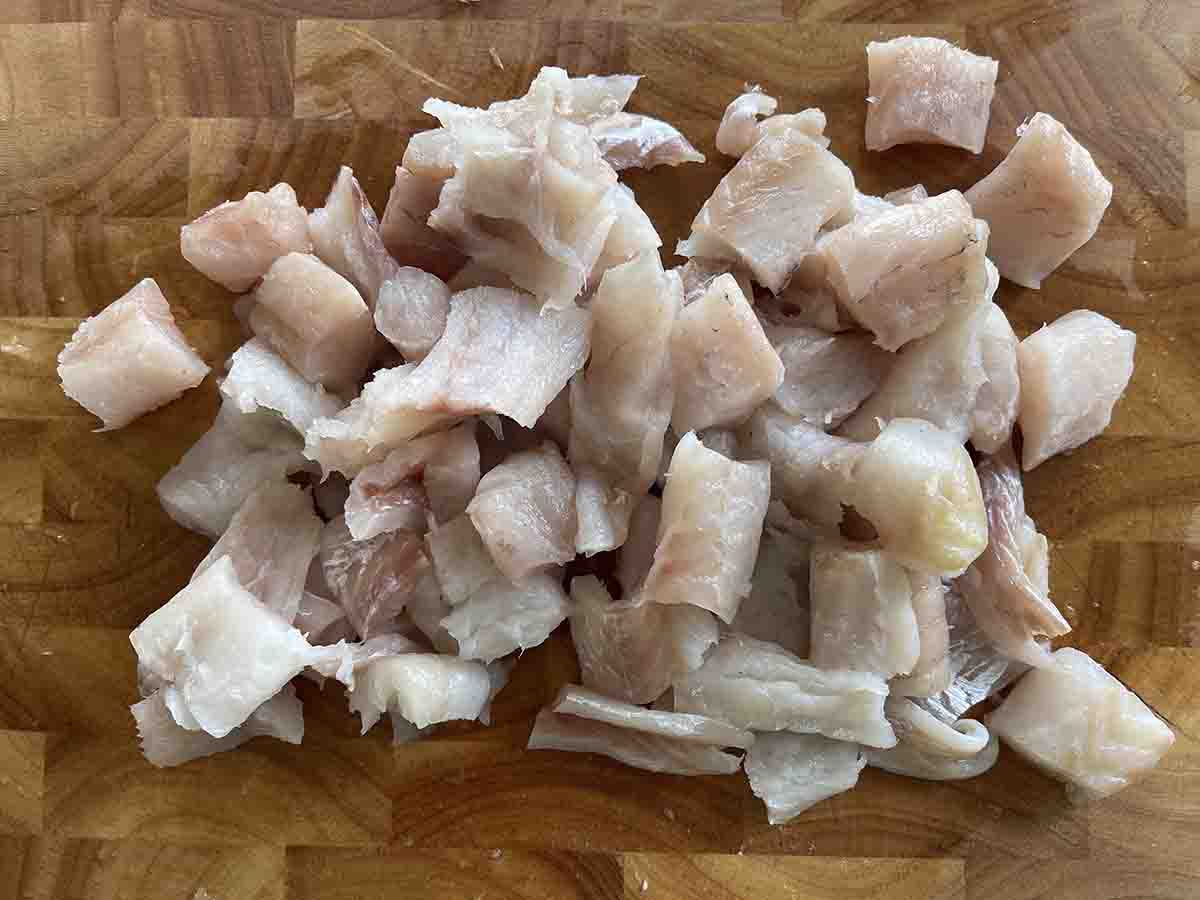 chopped fish on a board.