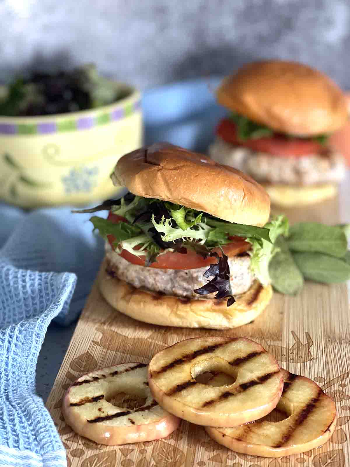 pork burger with apple in front.