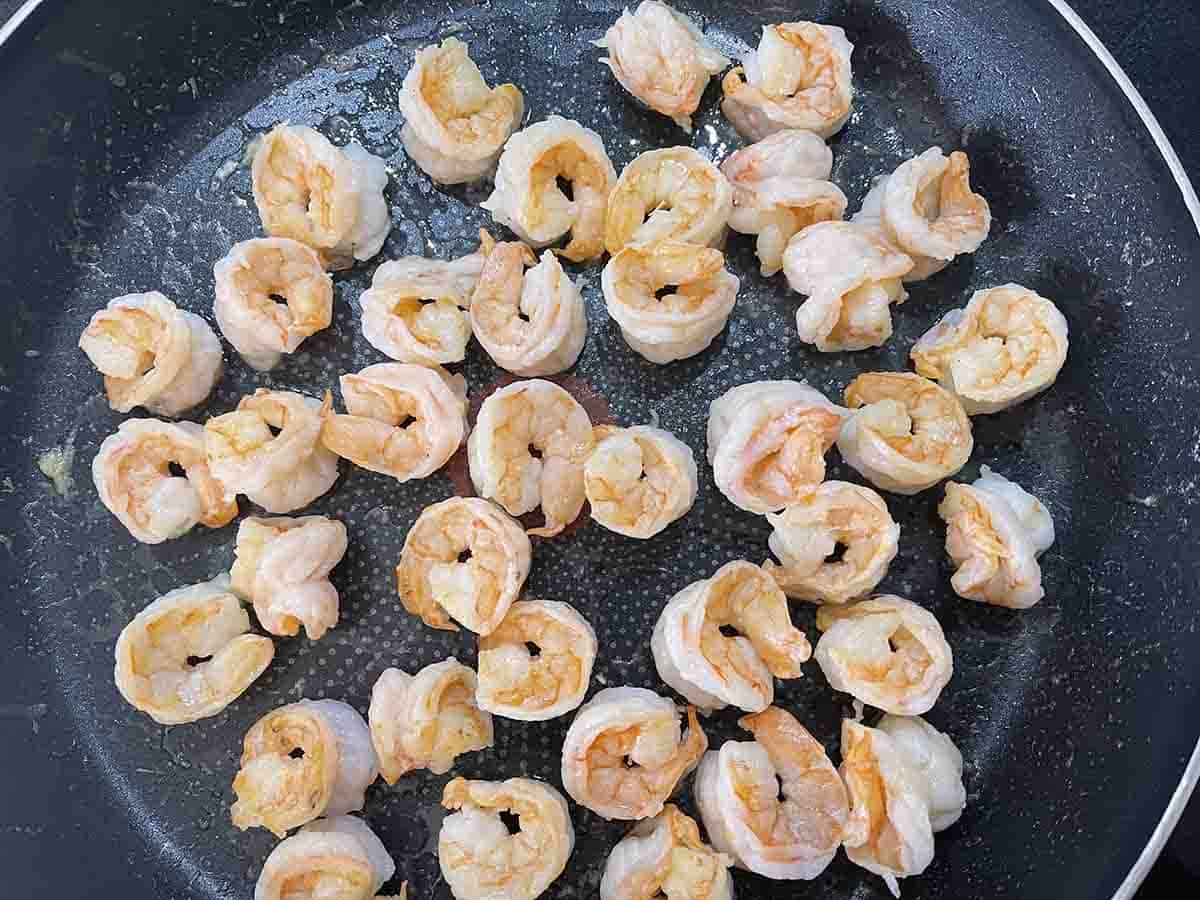 prawns cooking in a pan.