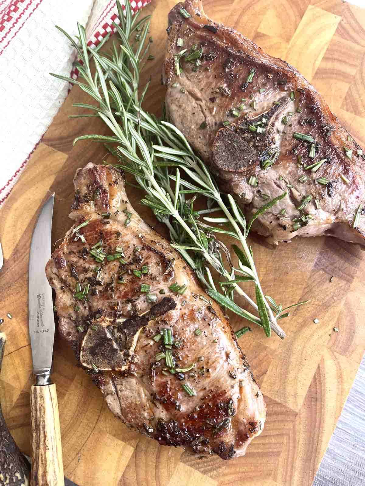 pan fried barnsley chops on a board.