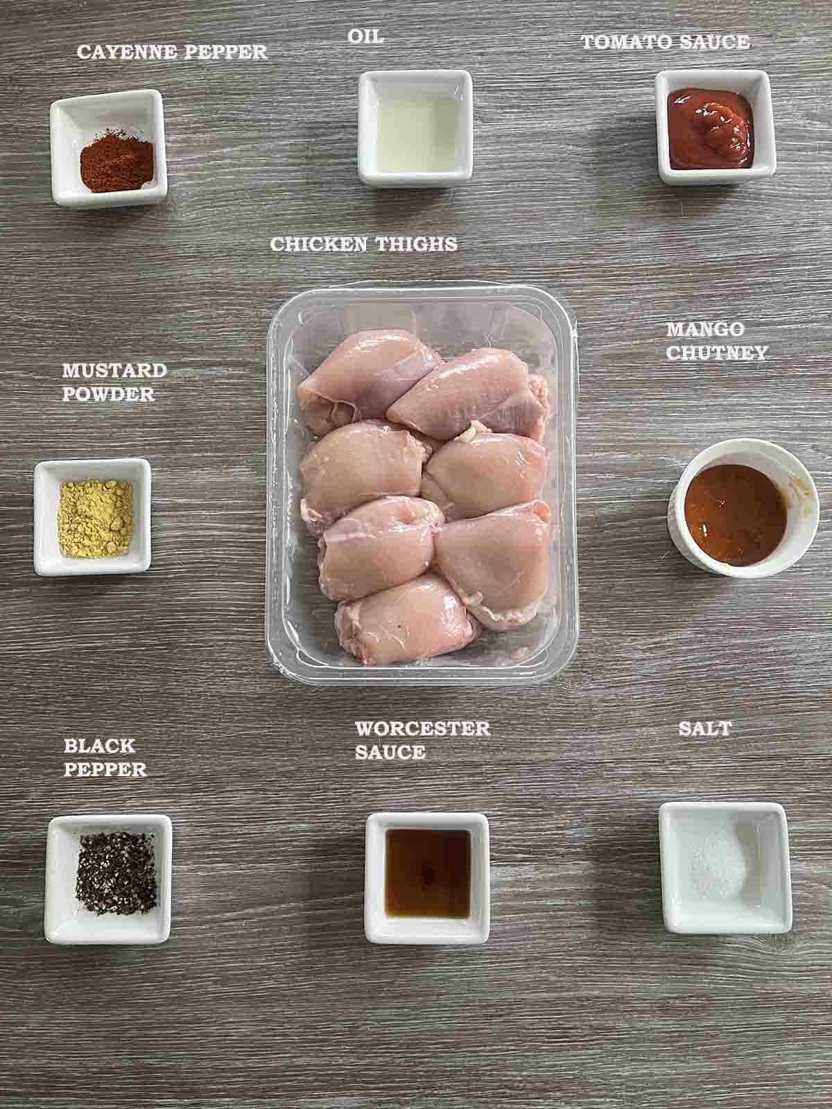 ingredients including chicken thigs, mustard, cayenne pepper and spices.