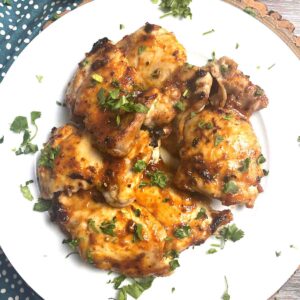 devilled chicken on a plate.