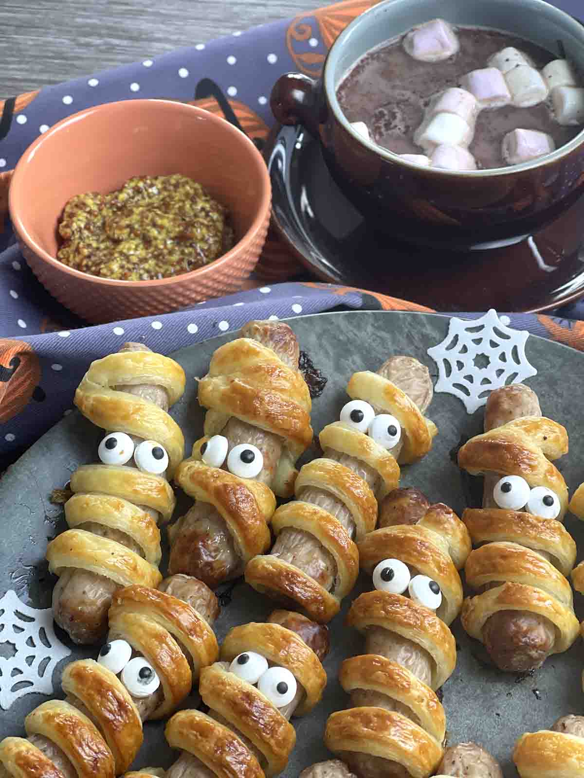sausage rolls on a plate.