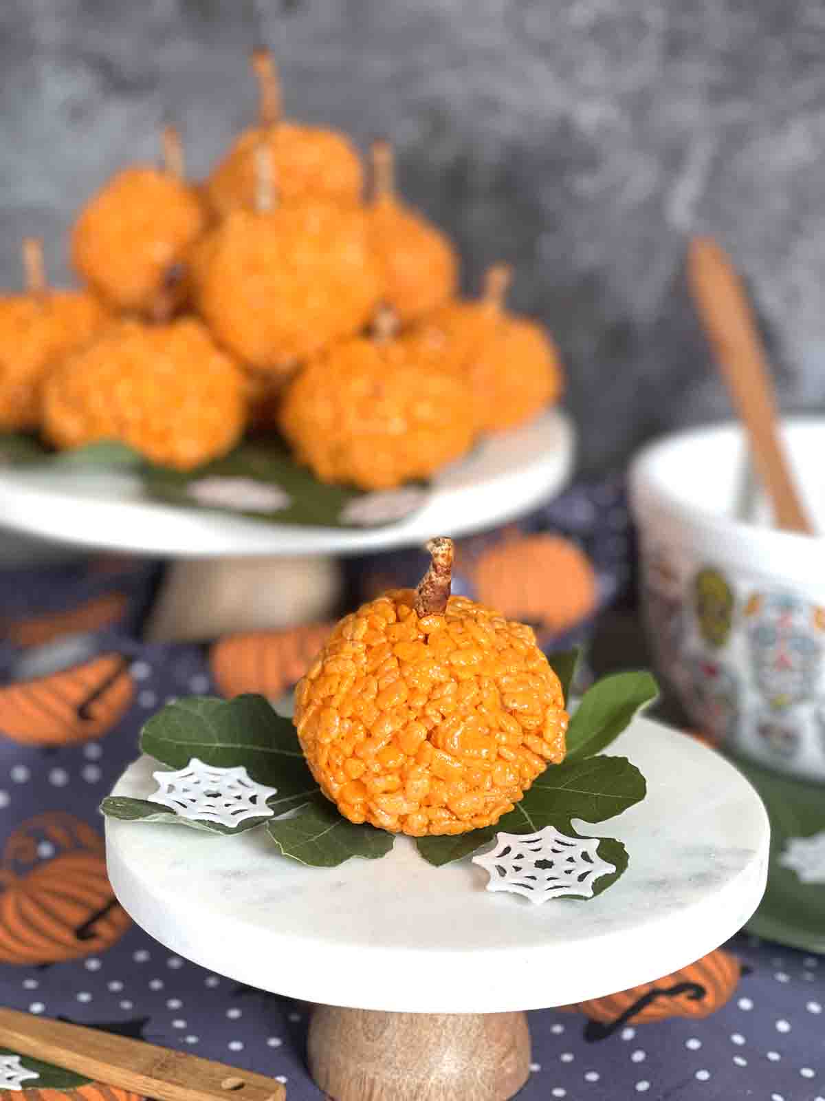 pumpkin rice krispie treats on a plate.