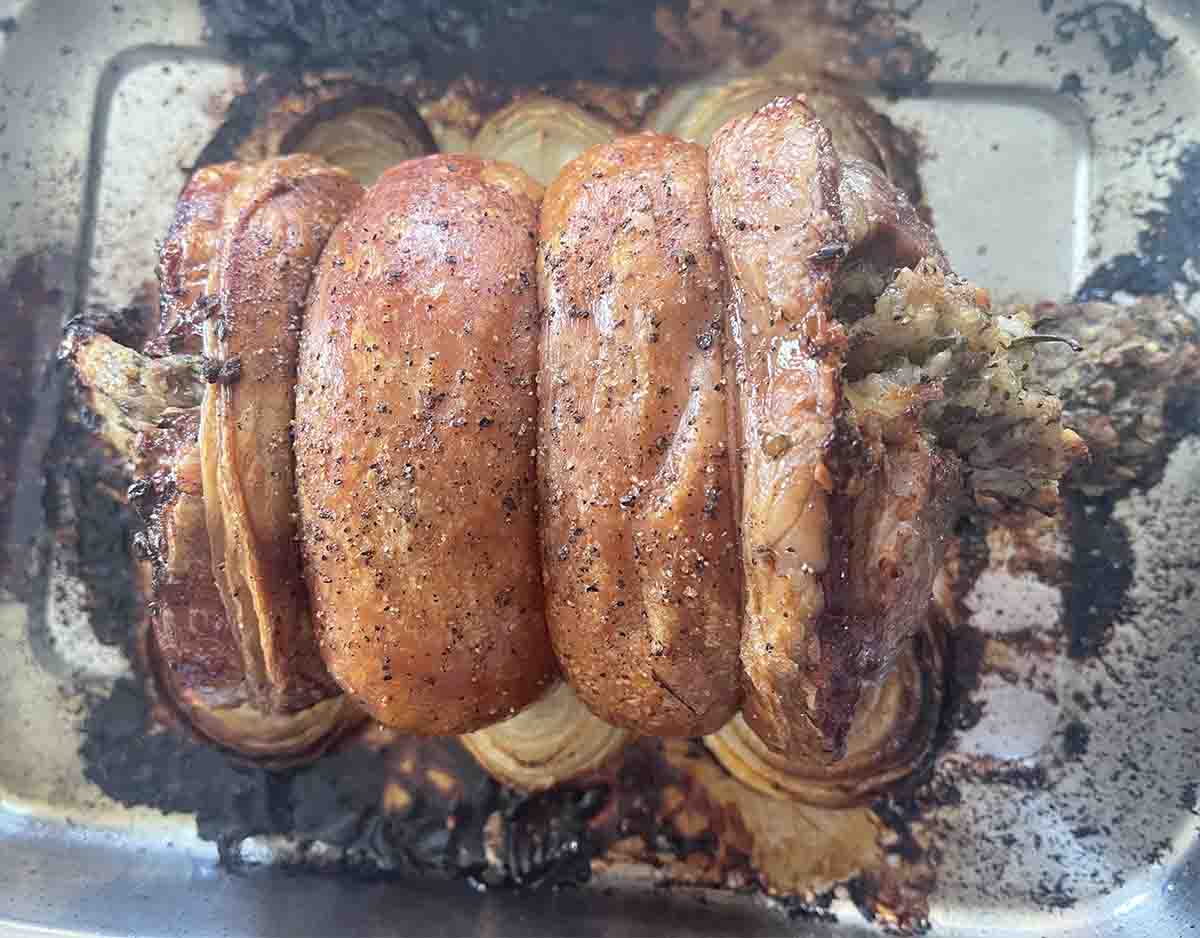 cooked lamb saddle in a dish.