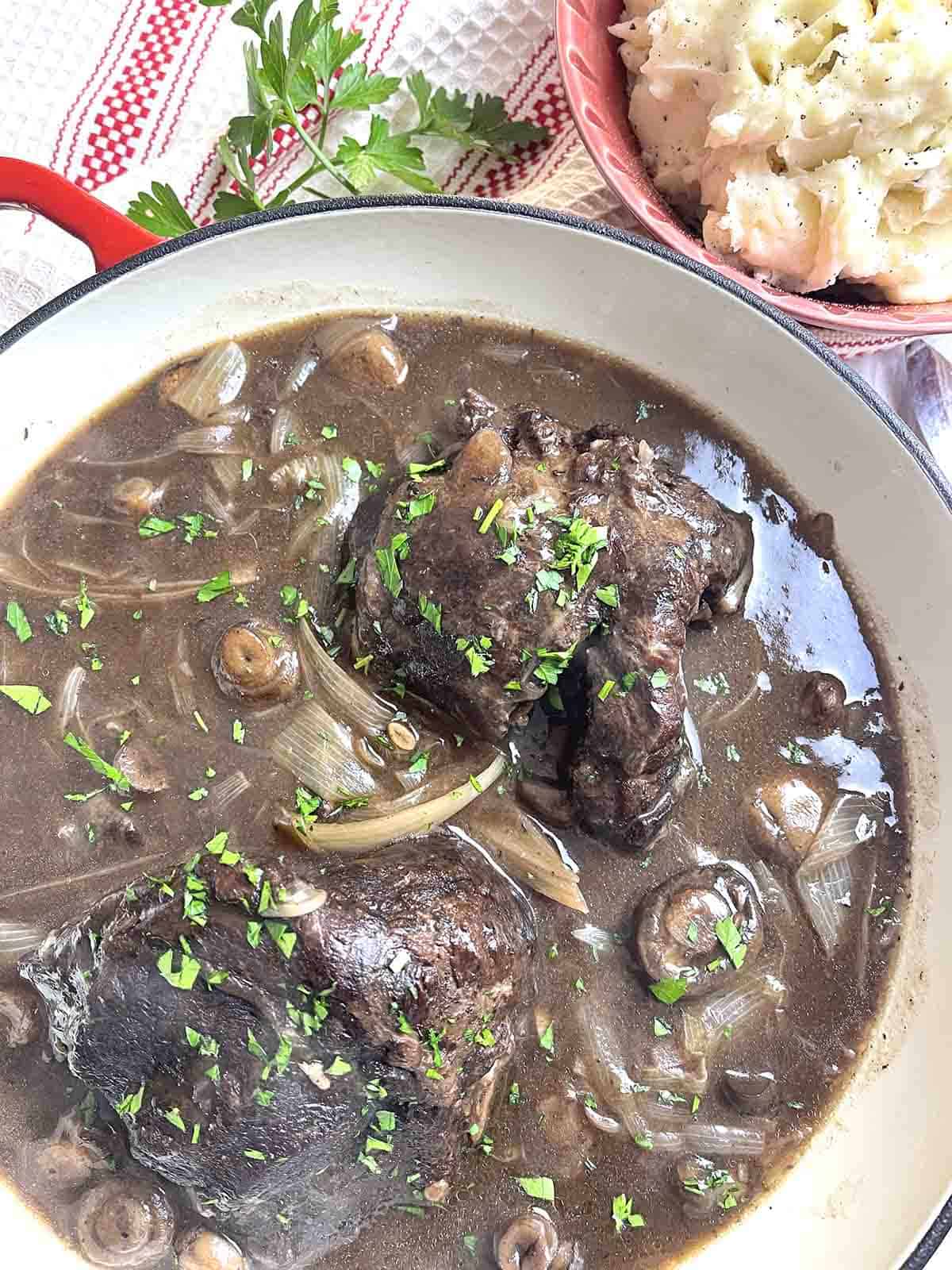 braised beef cheeks in a dish.