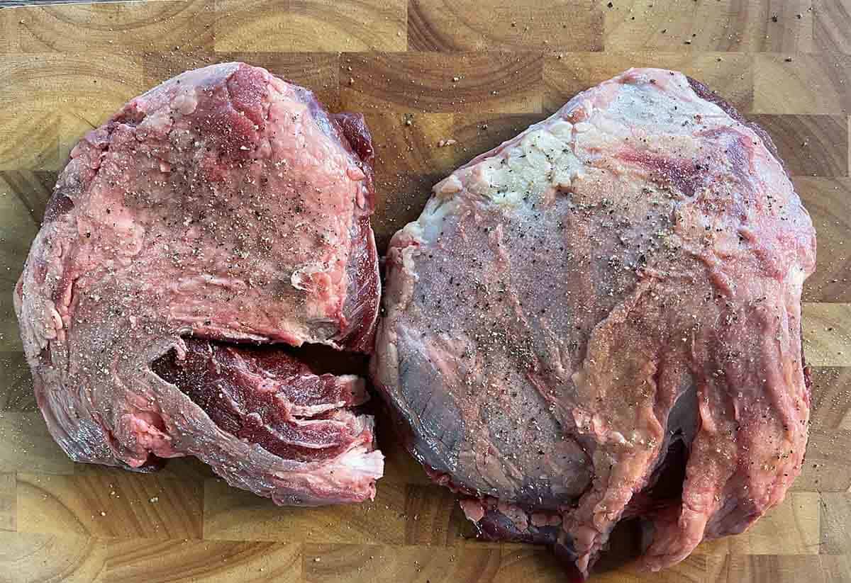 seasoned beef cheeks on a board.