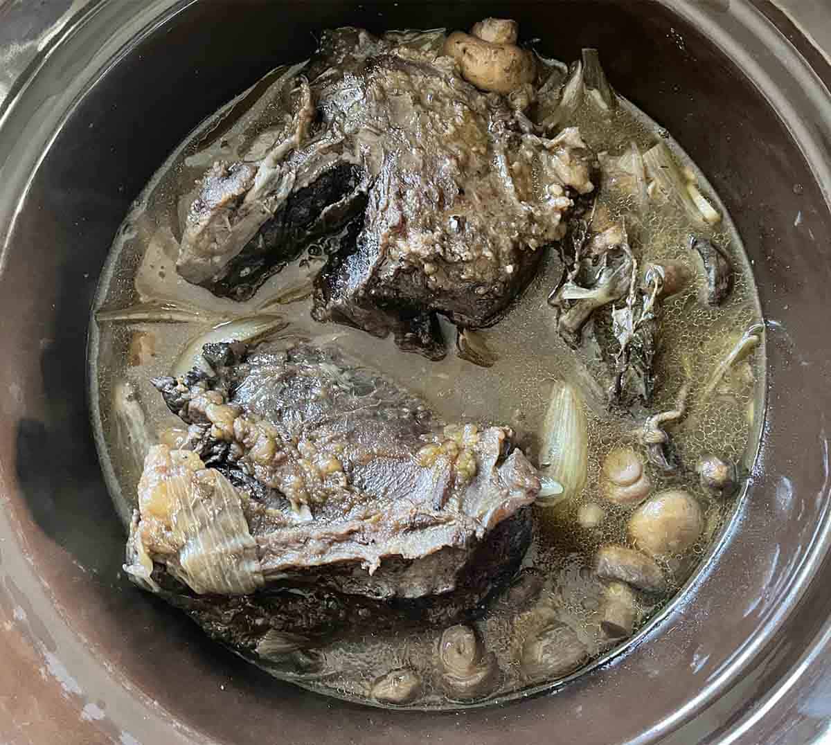 slow cooked braised ox cheeks before before thickener added.
