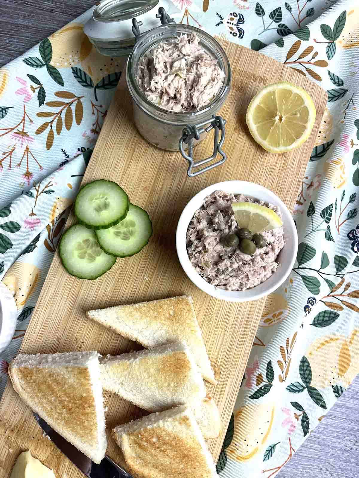 tuna pâté in a pot on a board.
