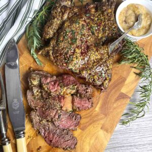 cowboy steak cut on a board.