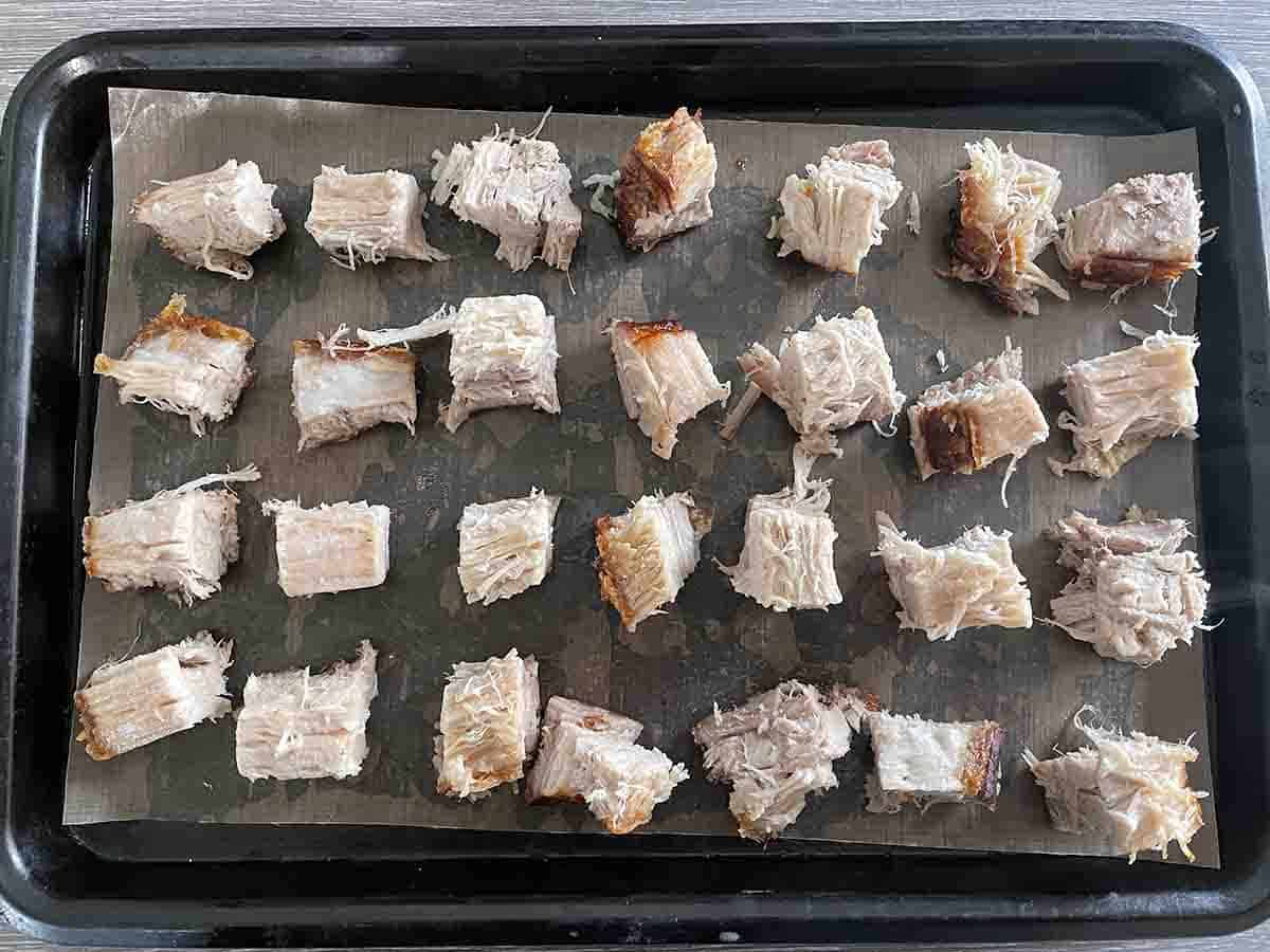cubes of meat on a tray.