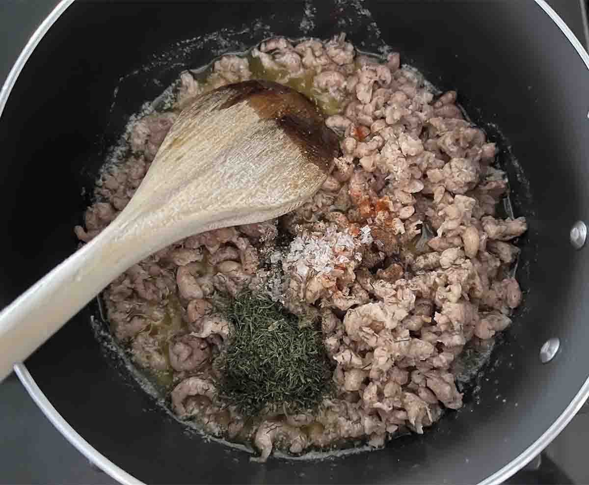 shrimps and seasoning added to pan.