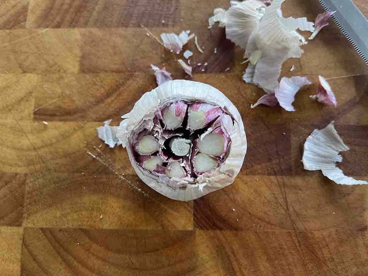 bulb of garlic with top cut off.