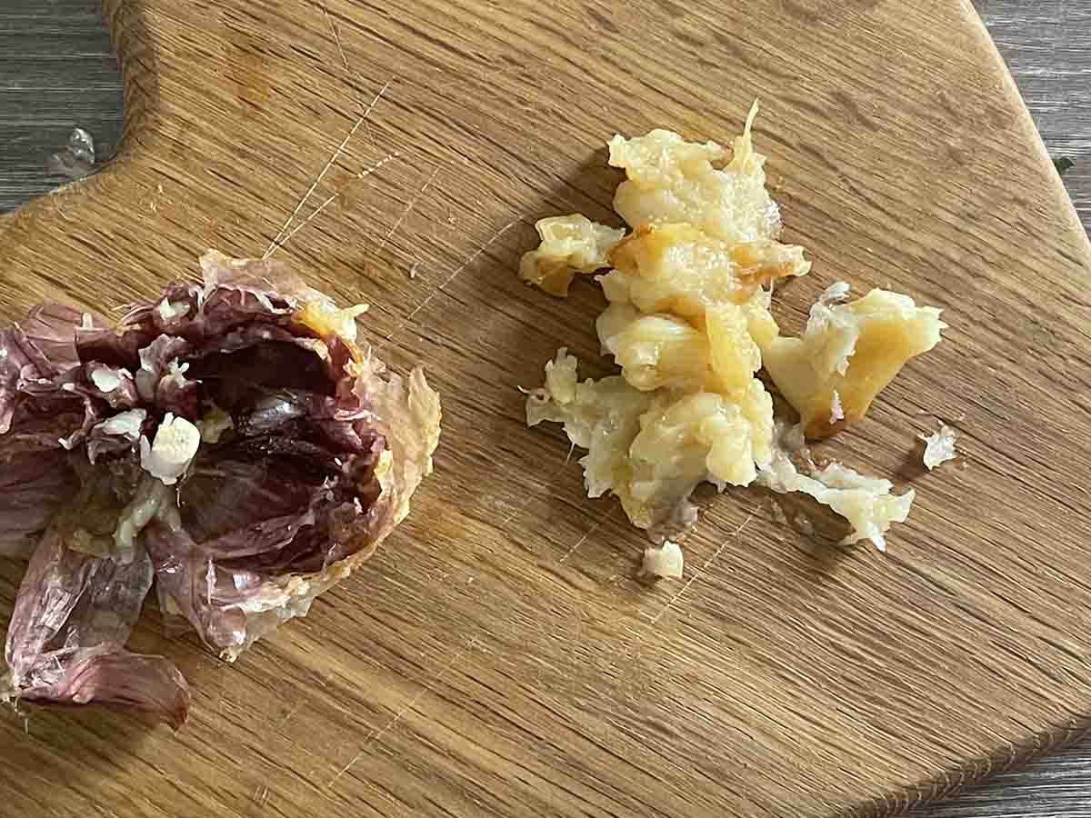 mashed roasted garlic on a board.