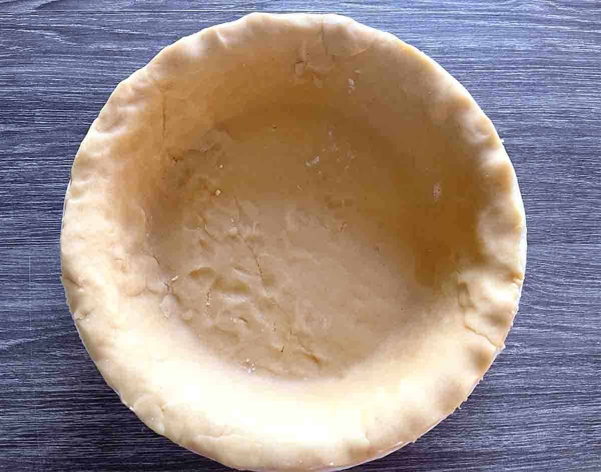 pie dish lined with pastry.
