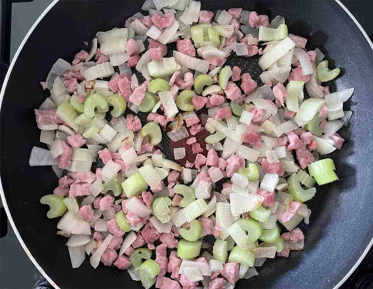 vegetables cooking in a pan.