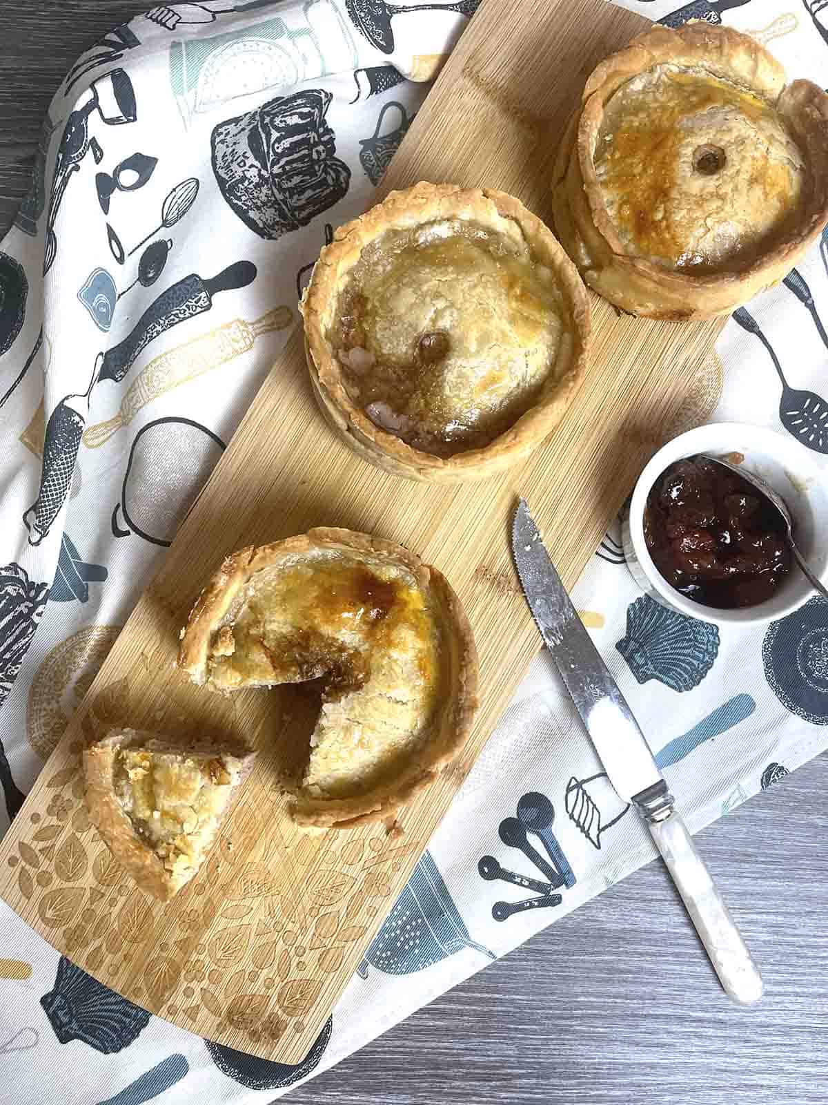 scotch pies on a board.