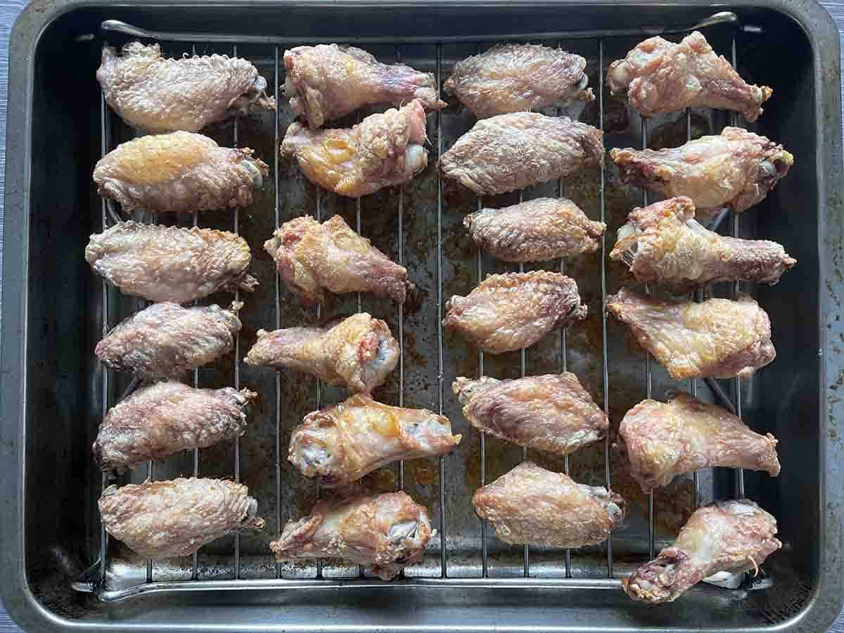 baked wings on a rack.