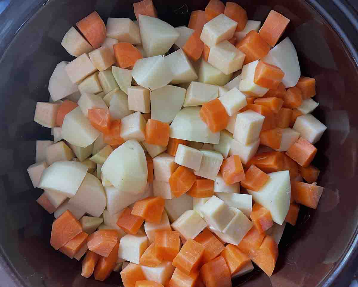 chopped vegetables in slow cooker.
