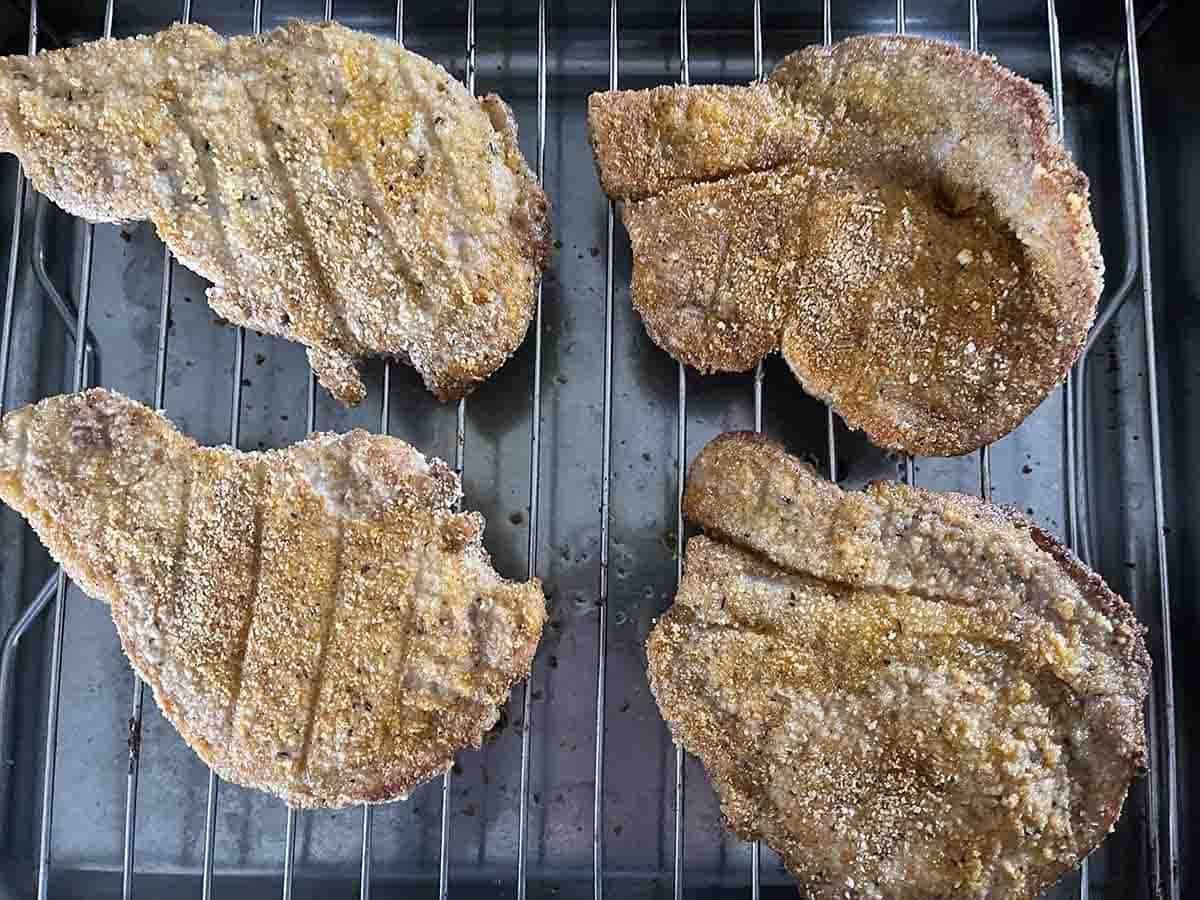 cooked chops on a grill.