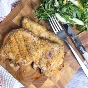 shake and bake pork chops on a board.