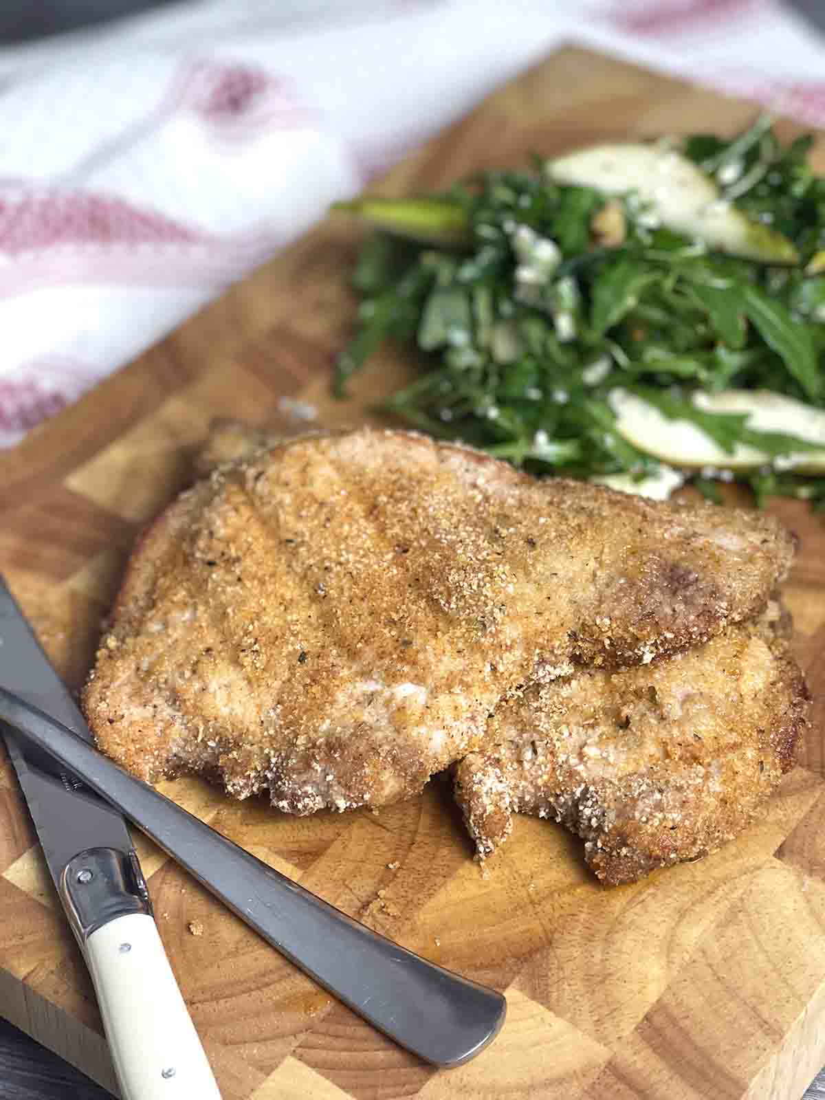 pork chop oin a board.