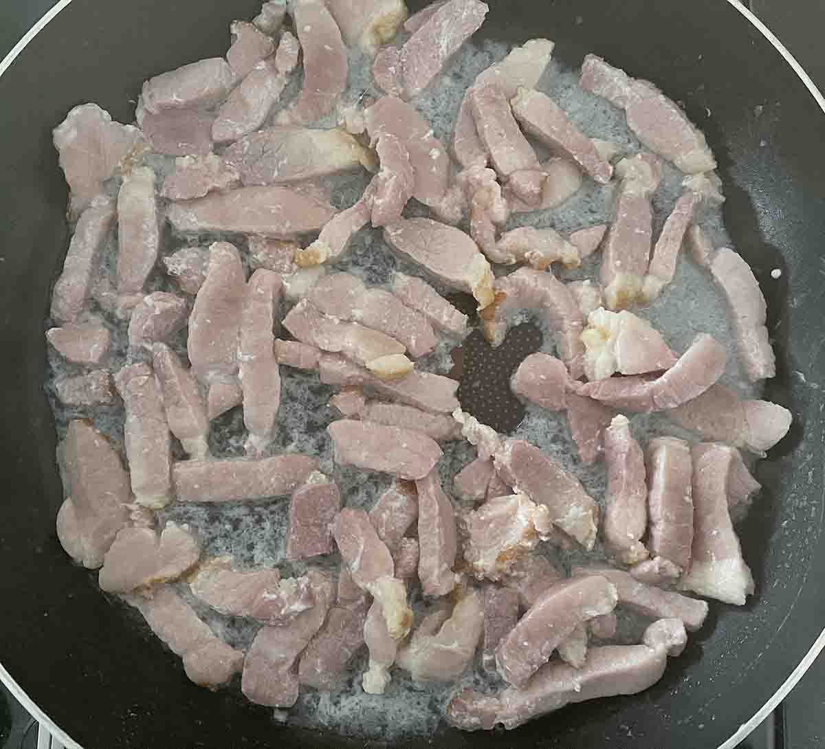 gammon cooking in a pan.