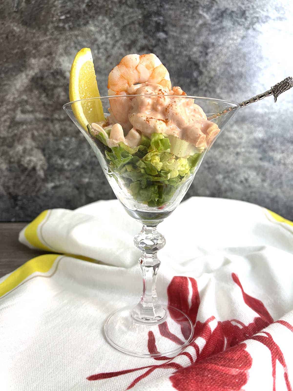 prawn cocktail with avocado in a glass.