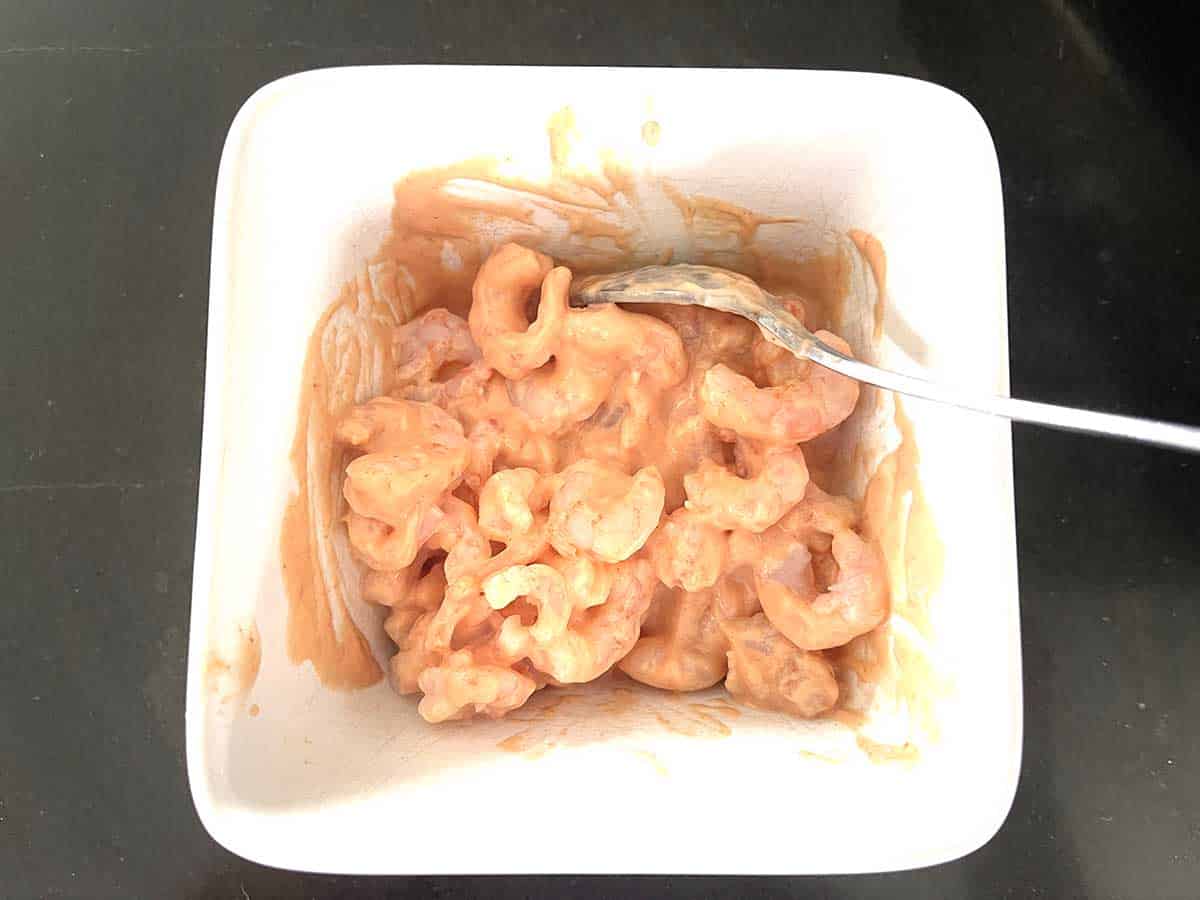 prawns mixed with sauce.
