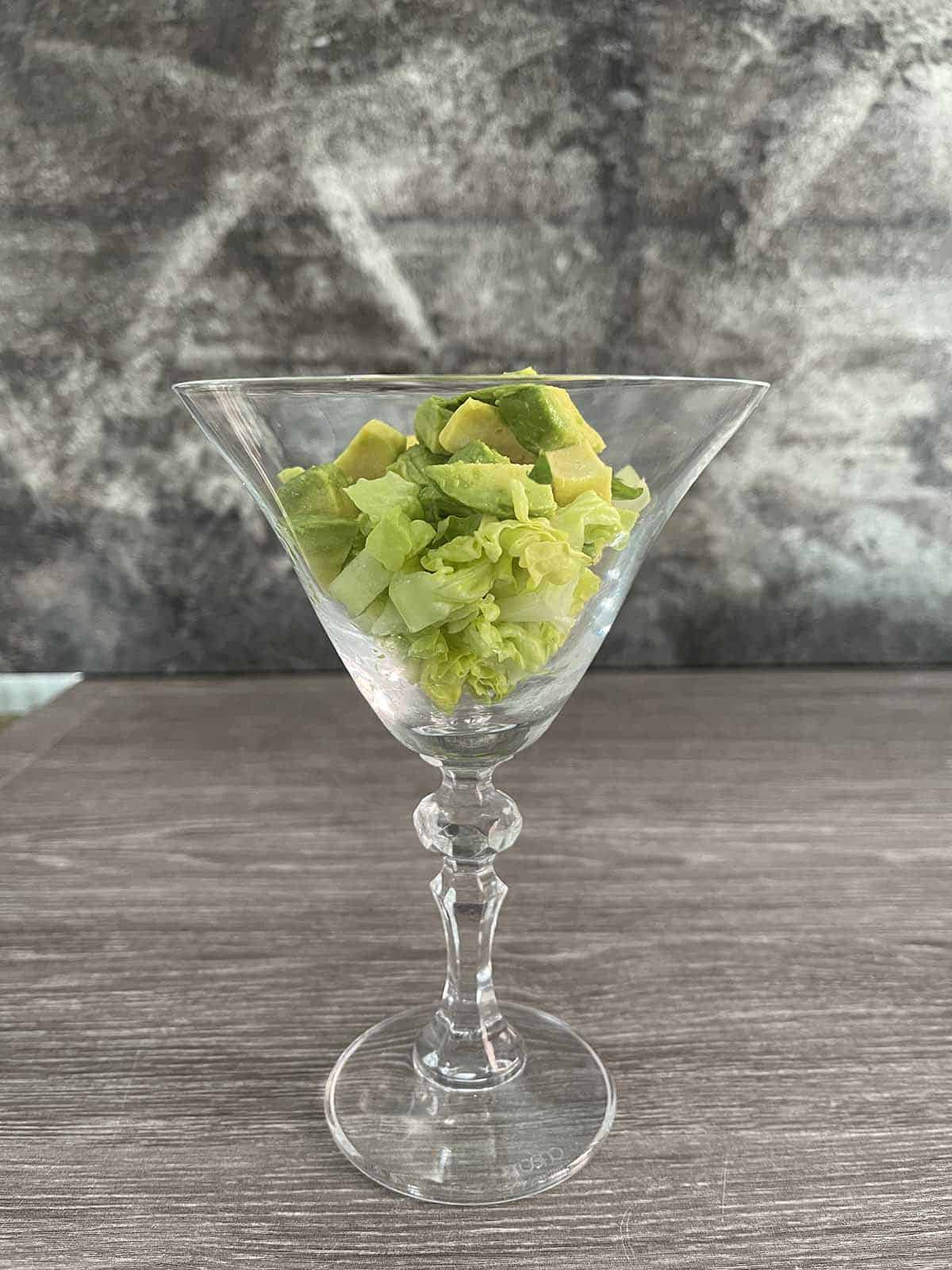 lettuce and avocado in a glass.