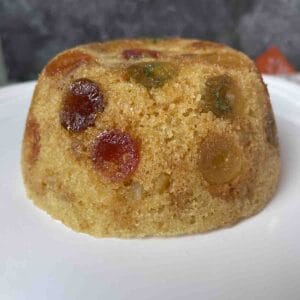 Cabinet pudding on a white plate.