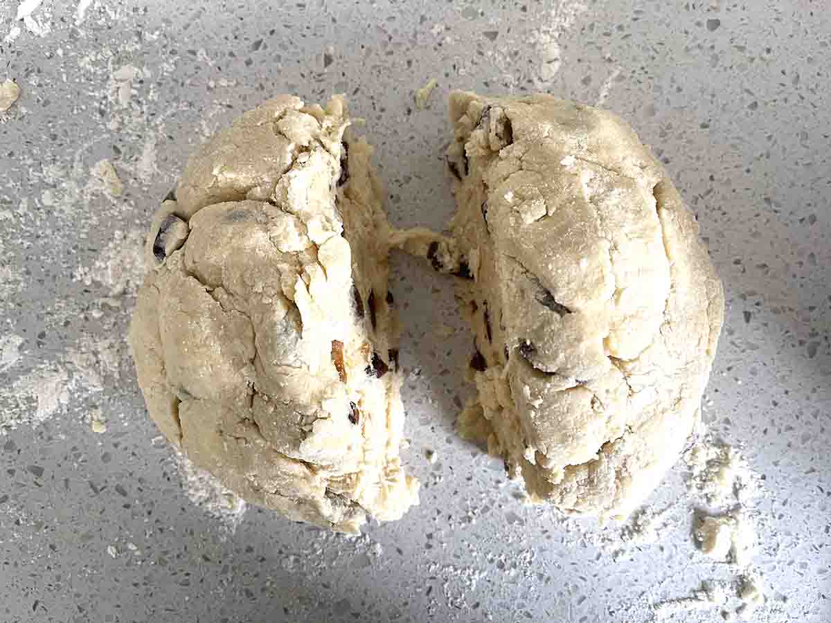 scone dough cut in half.
