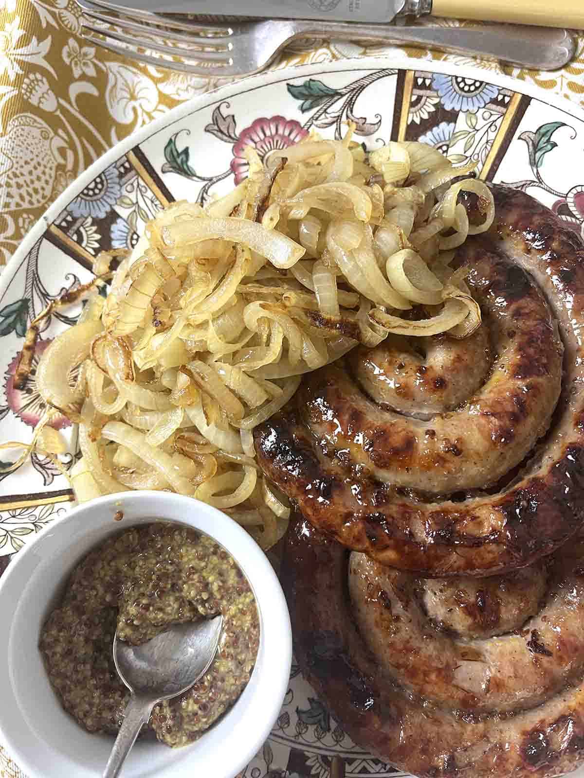 curly sausage with mustard.