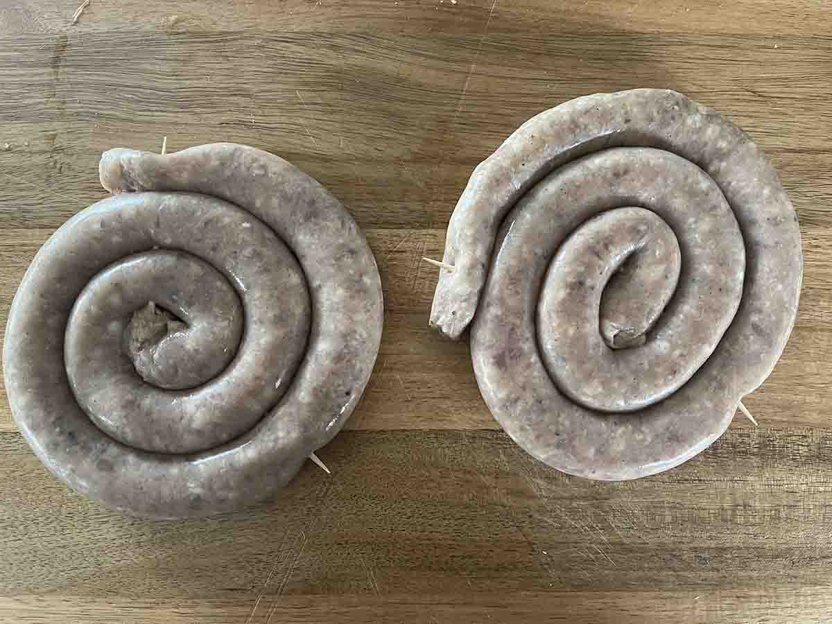 curly sausage with cocktail sticks in.