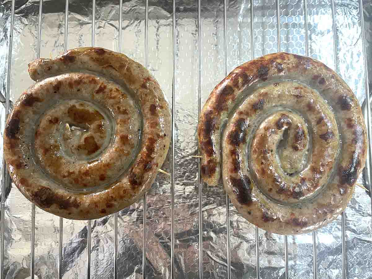 half grilled sausages.